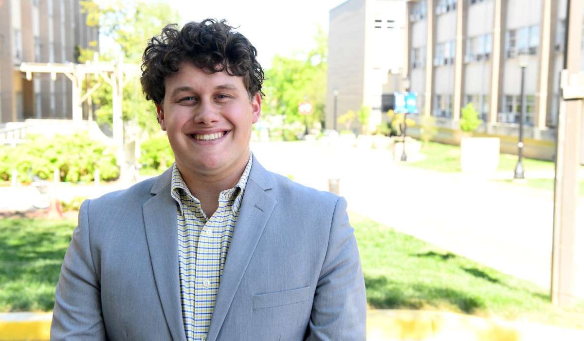 Elijah Feret standing on campus