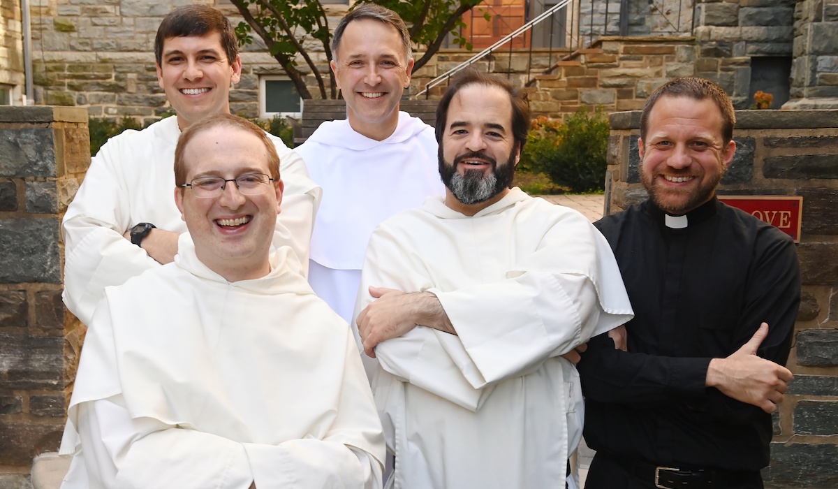 Catholic University chaplains smile for a group photo