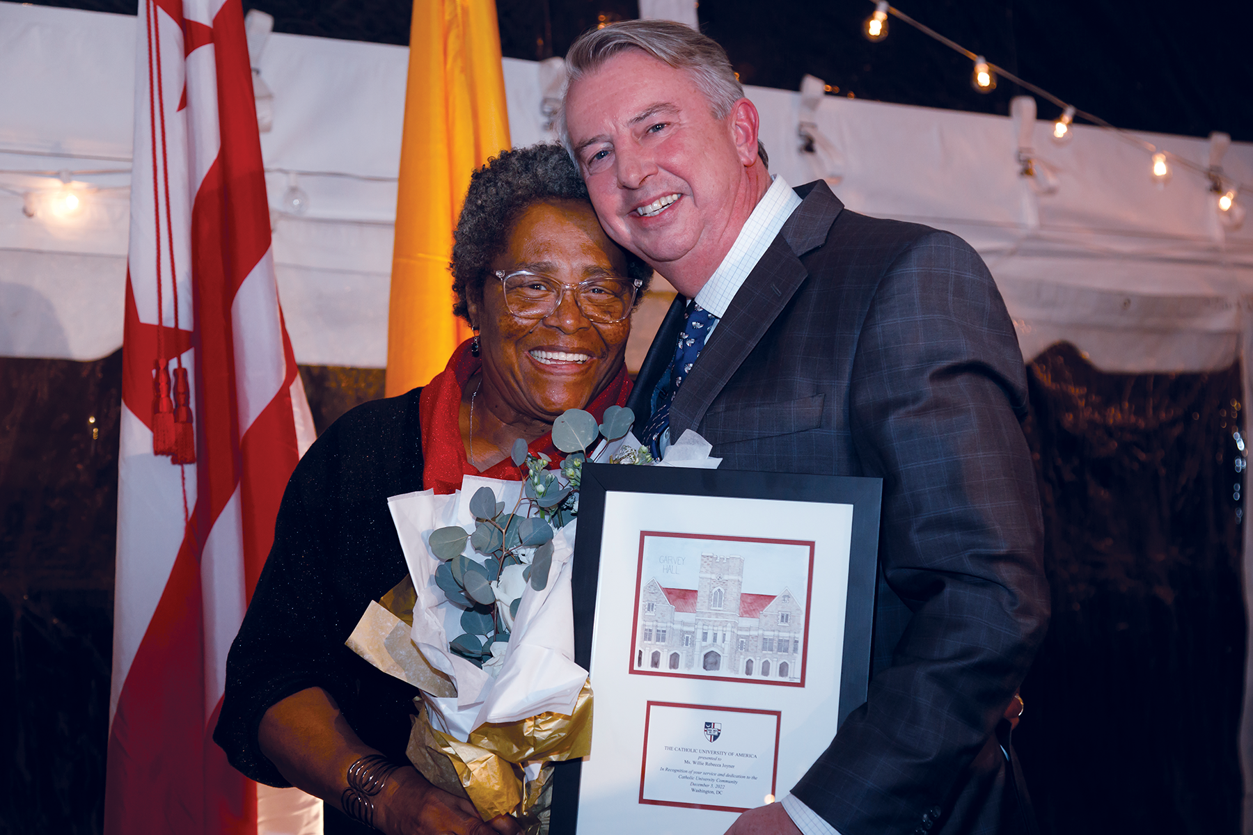 Willie Joyner and Ed Gillespie celebrate the new Garvey Hall and a dining room named in her honor.