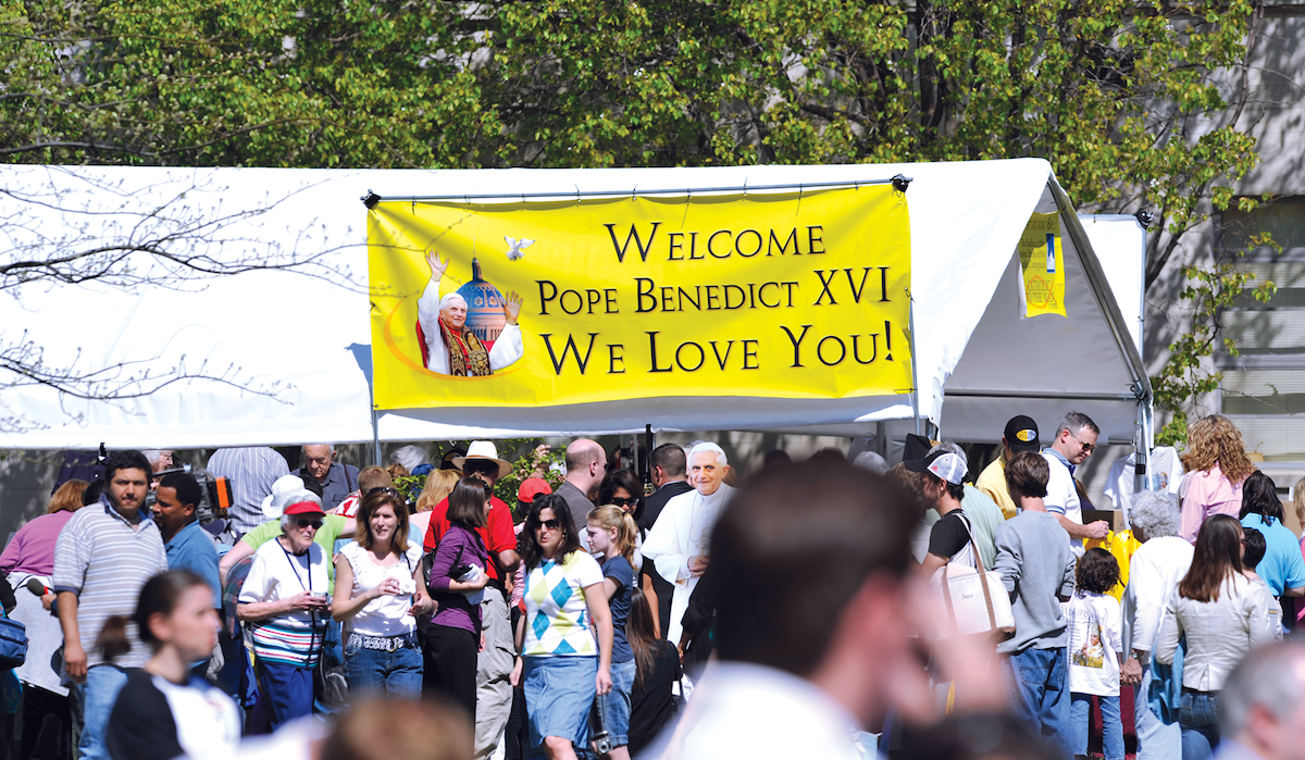 A sign that says "Welcome Pope Benedict XVI. We Love You!"