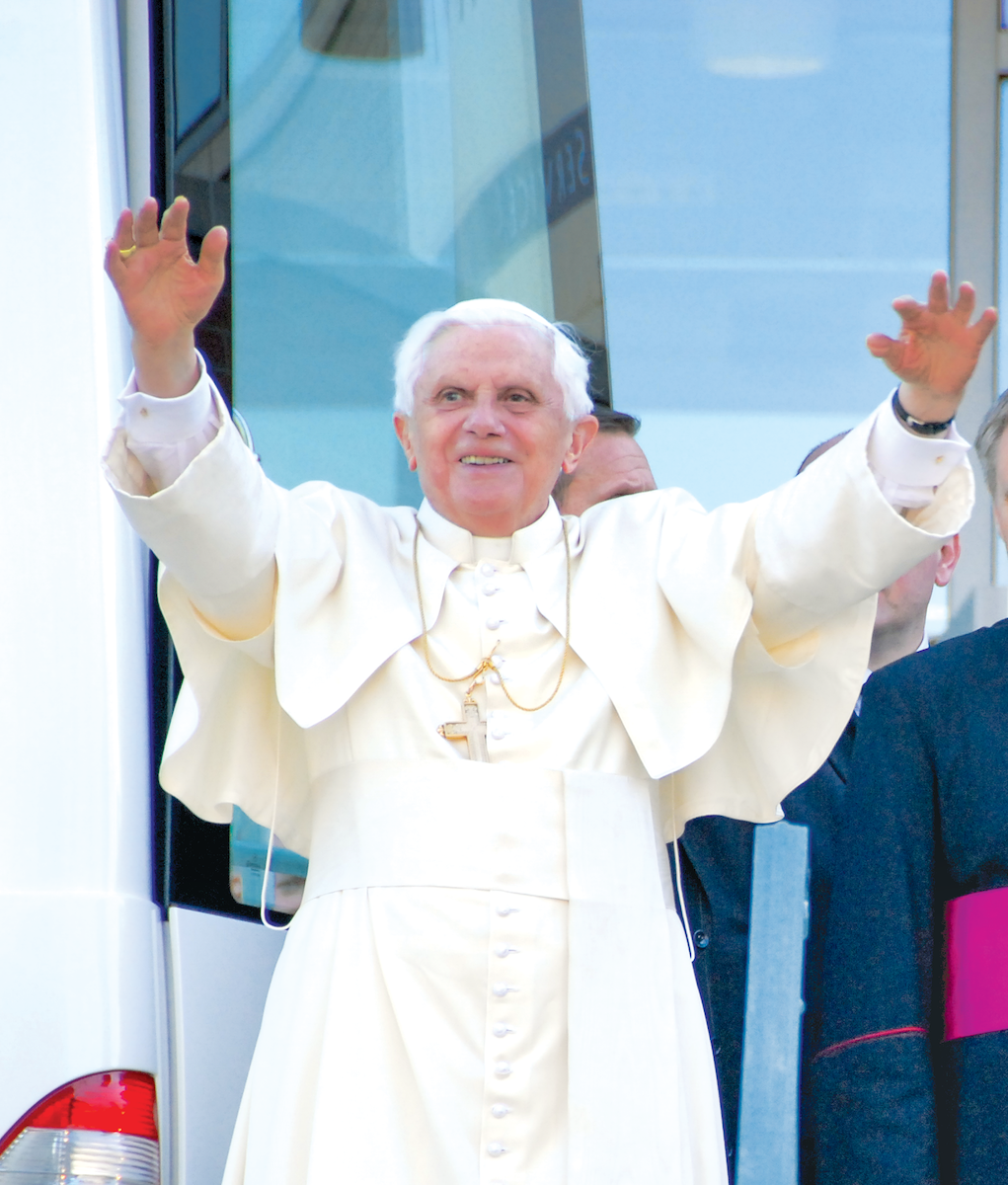 Pope Benedict XVI smiling with arms outstretched