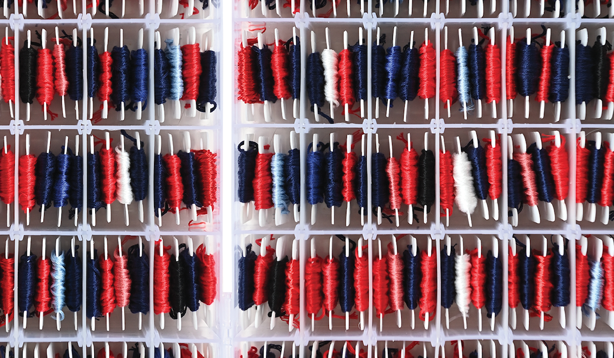 spools of red and blue thread