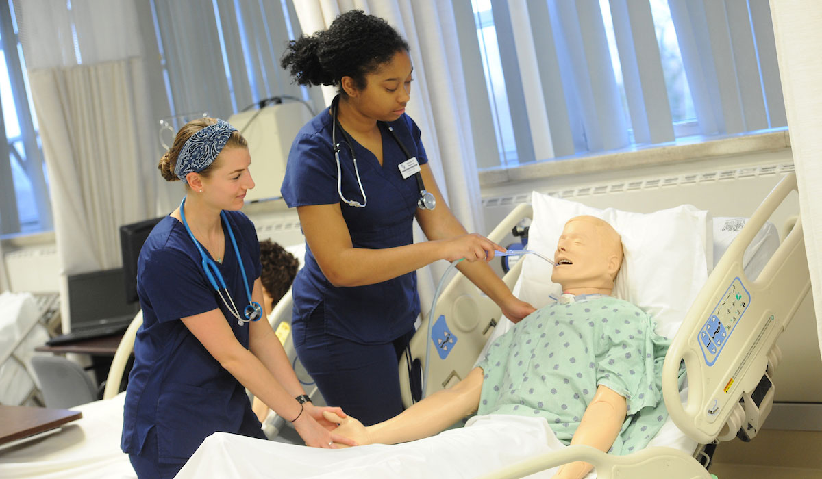 Nurses with dummy patient