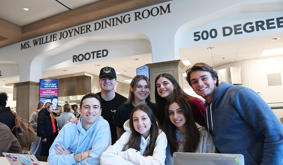 Group of students posing in the dining room