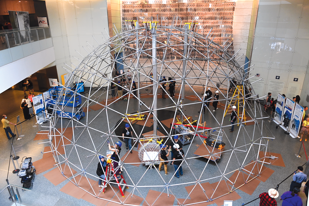 students building the geodesic dome in the US History museum