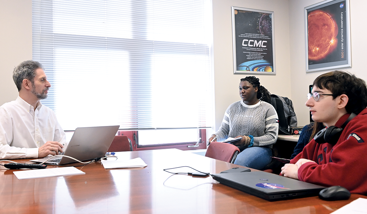 Associate Professor of Physics Vadim Uritsky teaching at the University’s Space Weather Center, an on-campus lab where students can study space weather events in real-time and learn forecasting skills.