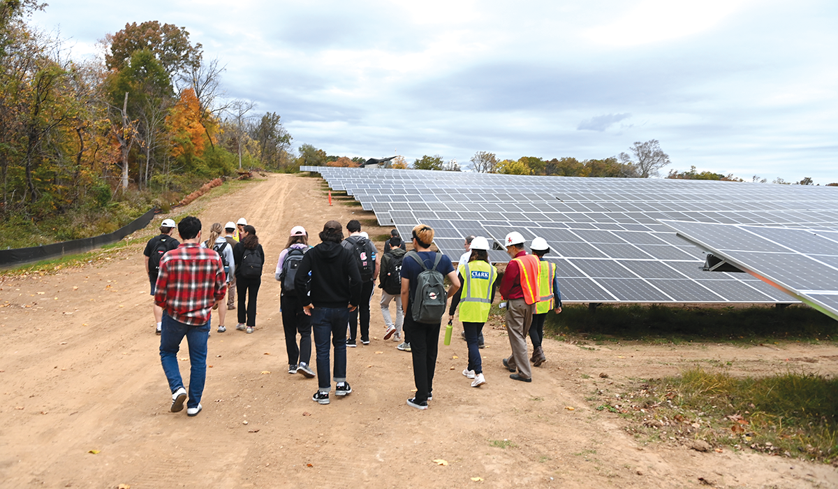 Students tour the solar array project as part of an energy course.