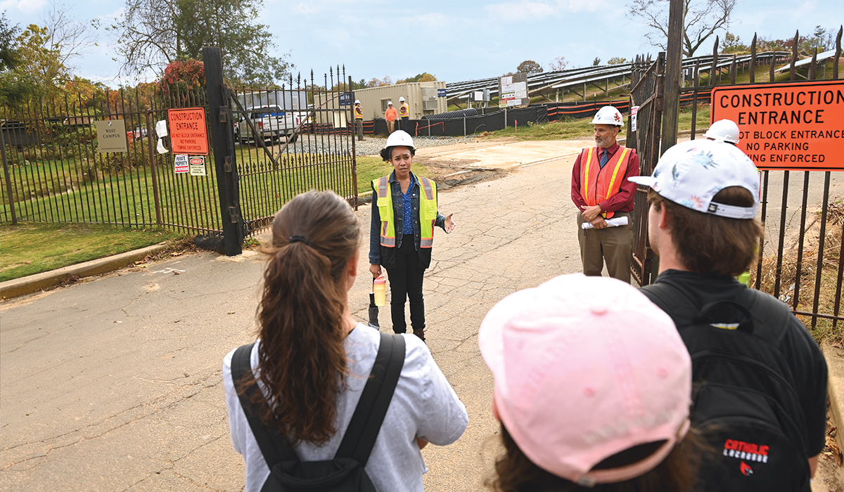 Alexandra Harry Napier leads a tour of the solar array under construction