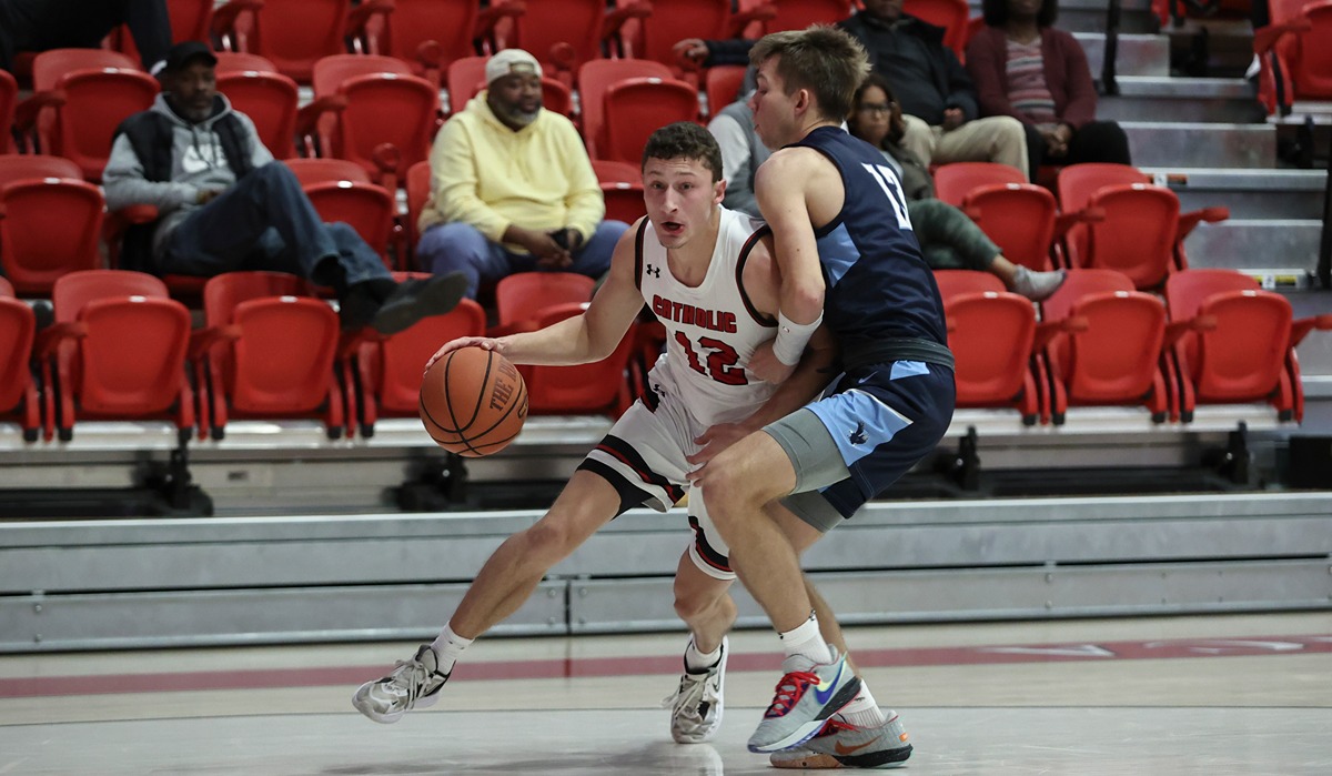 Basketball player defending another player