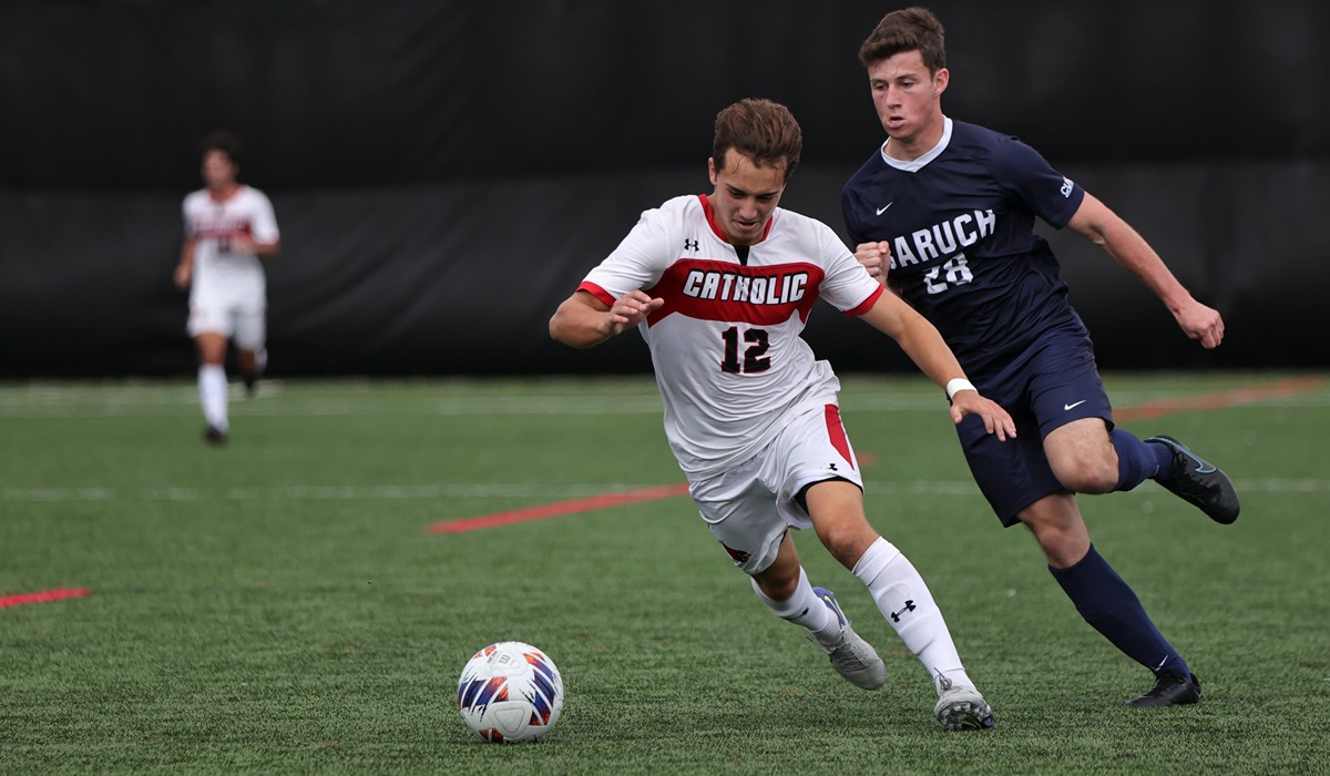 One player pursues another for the ball