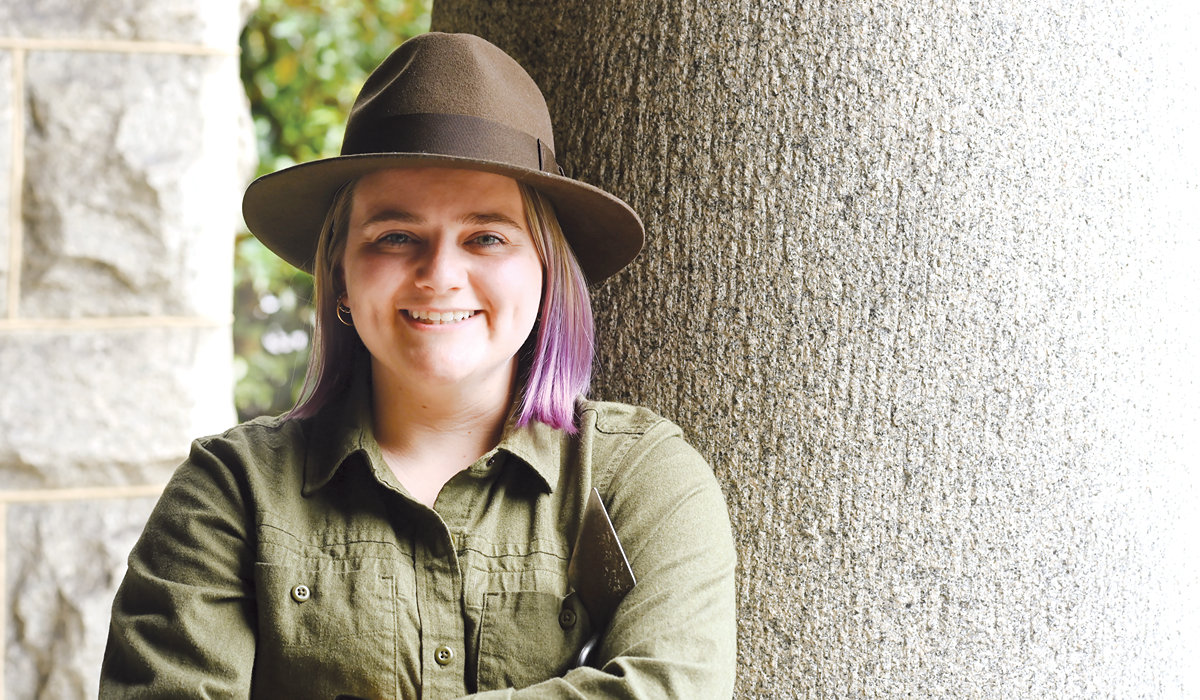 student in an Indiana Jones-style hat