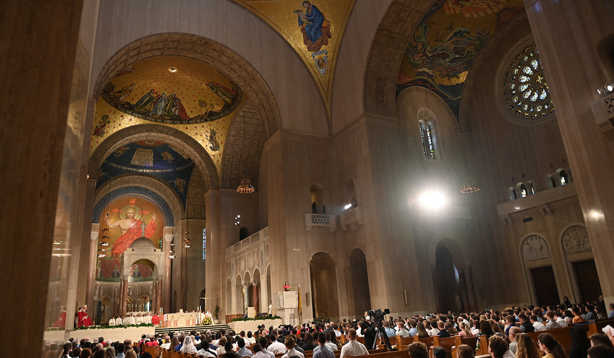 Mass of the holy spirit crowd and basilica ceiling