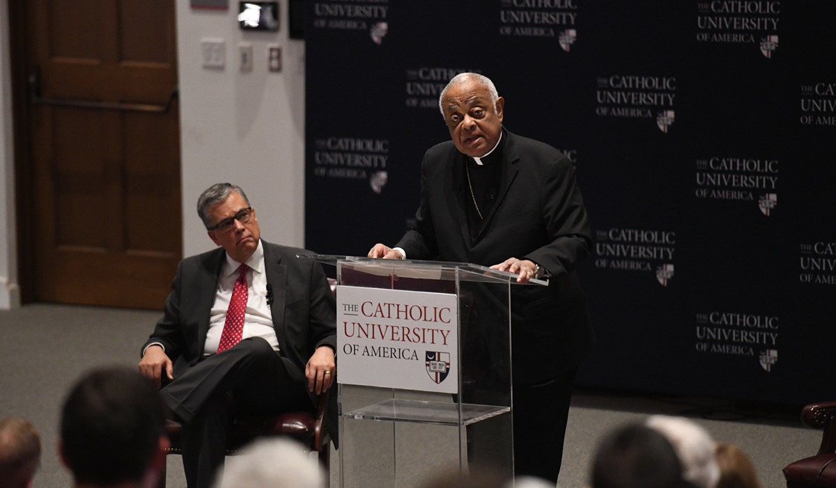 president kilpatrick listens as cardinal wilton gregory shares his experience