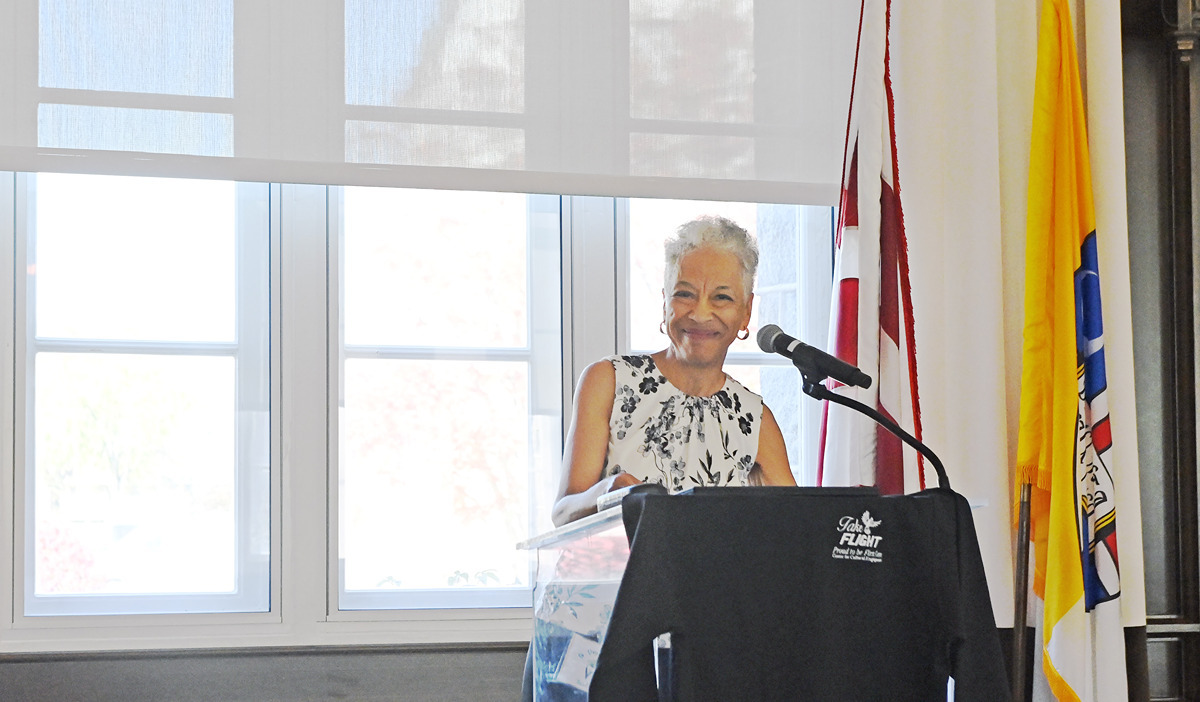 Law Professor Veryl Miles shares words of wisdom while smiling at a podium