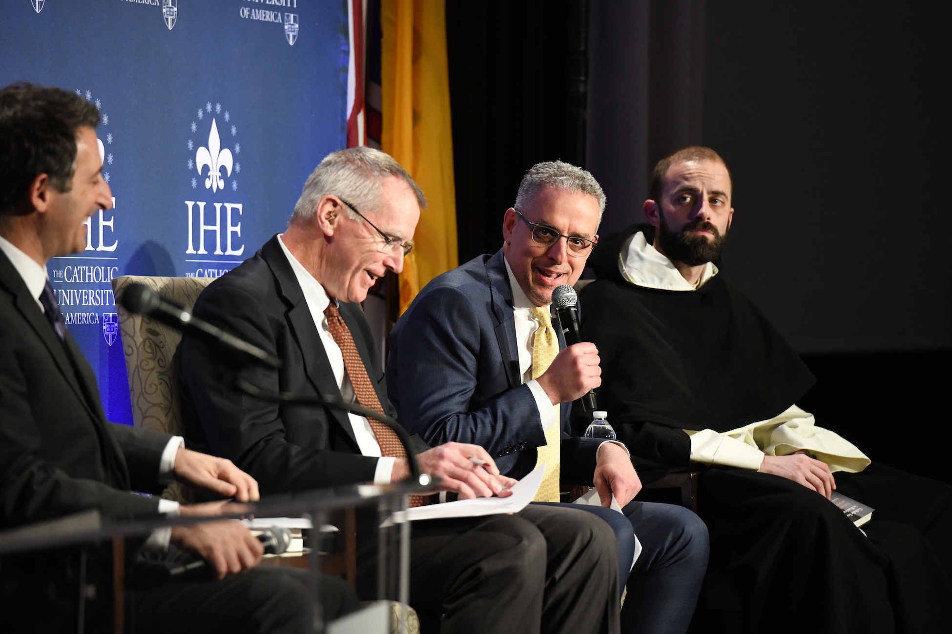 panel speaking at an event run by the Institute for Human Ecology