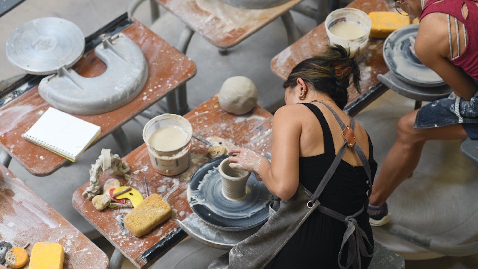 student making a ceramic pot