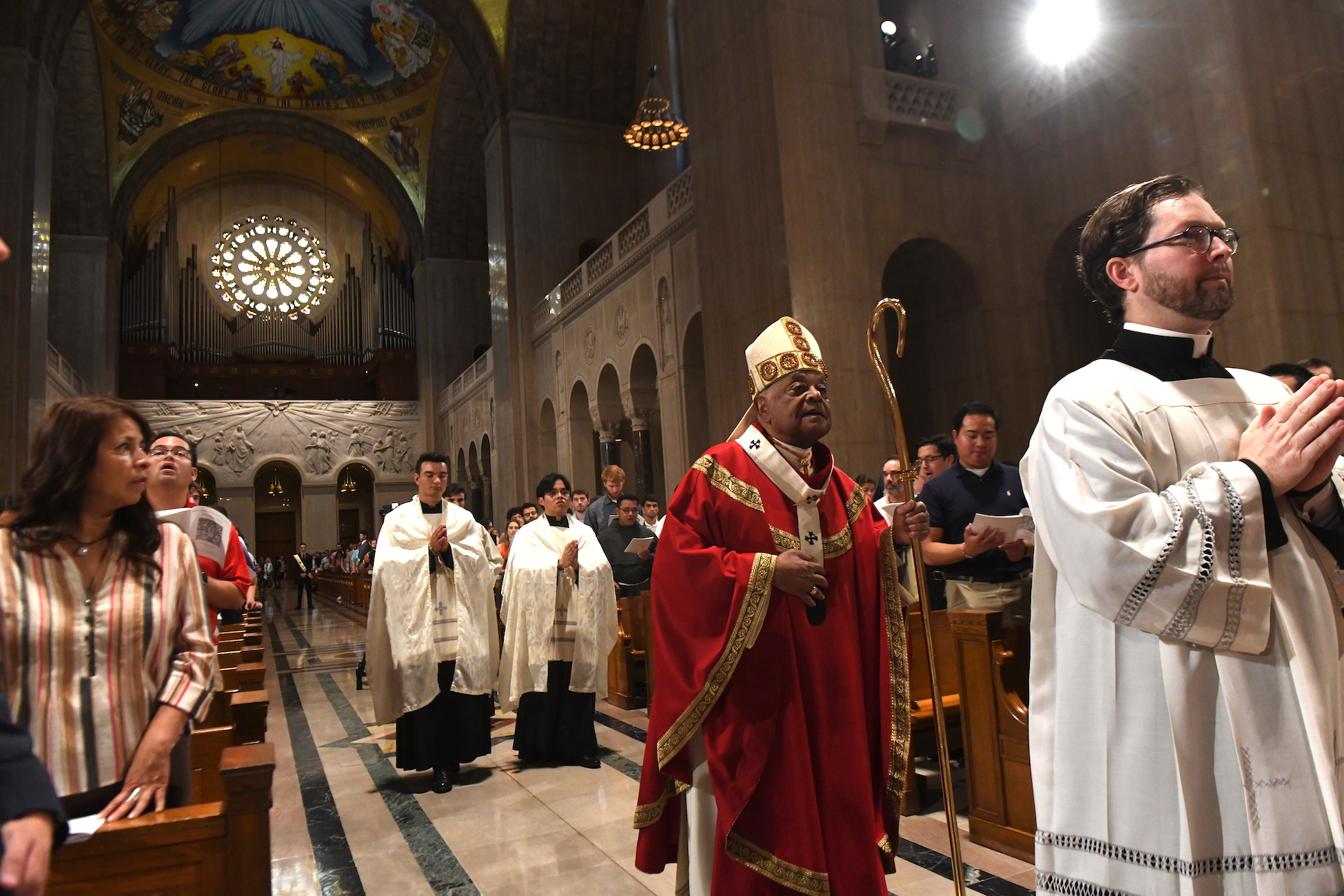 Cardinal Wilton Gregory processes to the altar during catholic university's Mass of the Holy Spirit