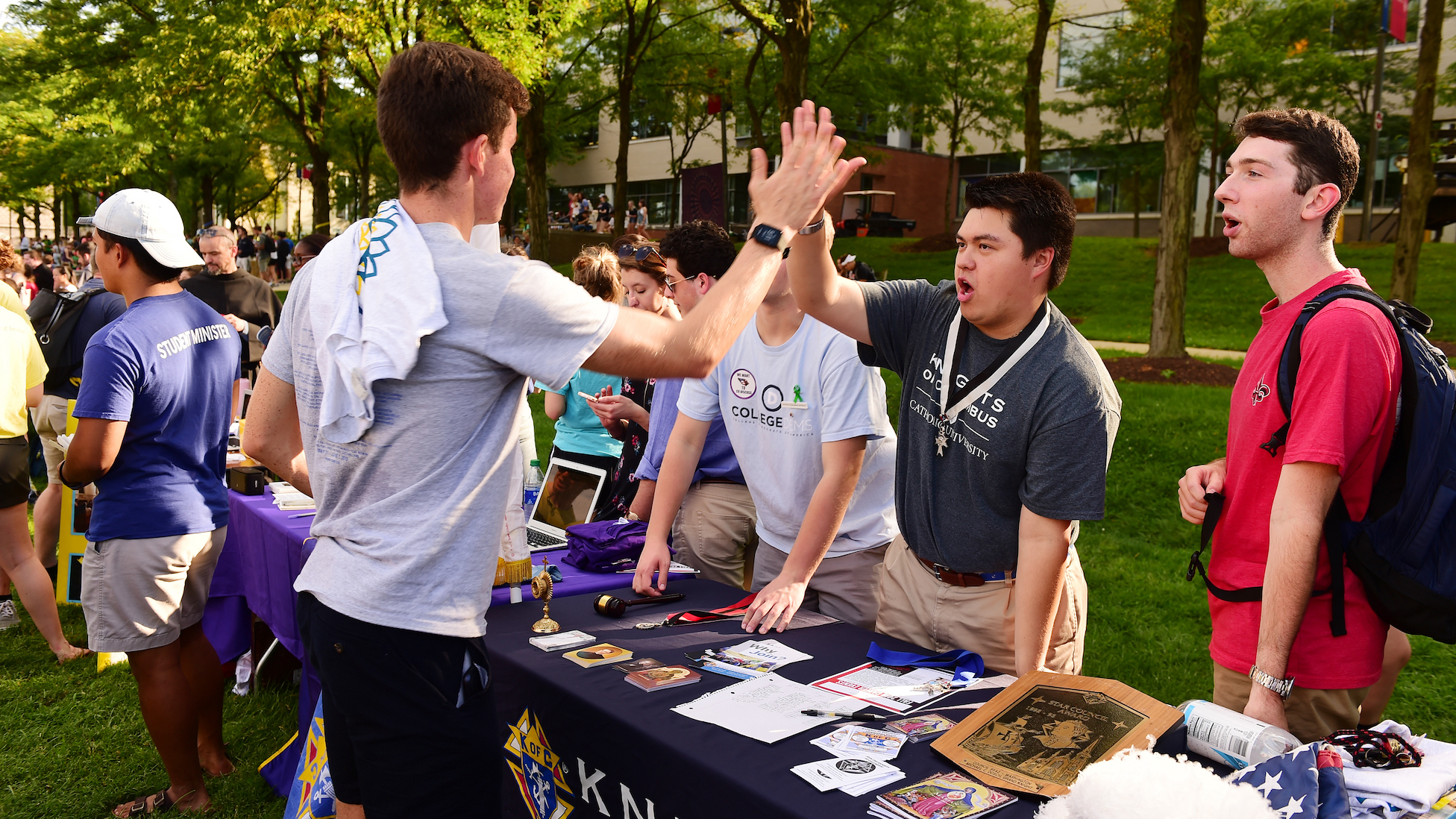 male students high fiving