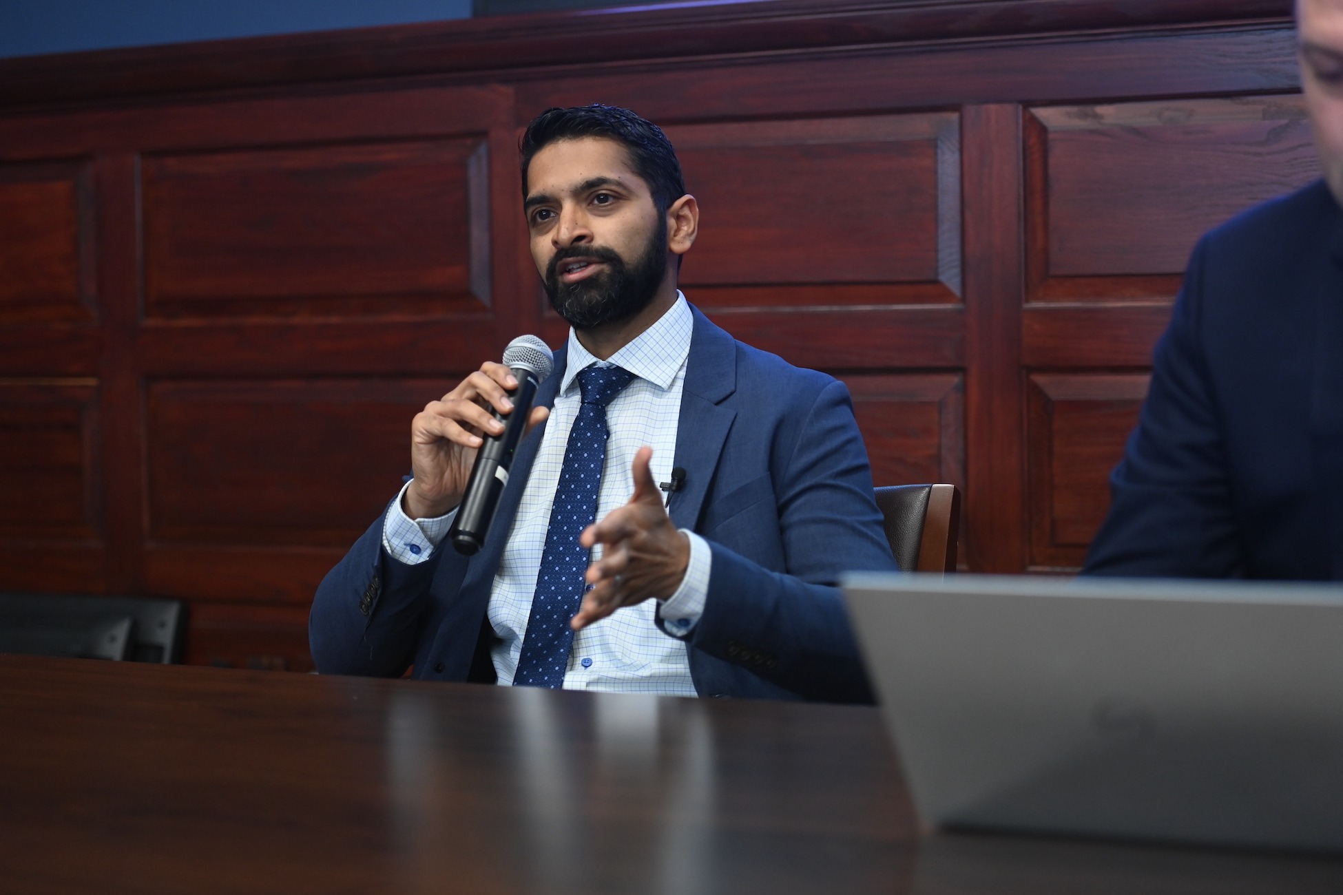 Sociology professor Brandon Vaidyanathan speaking at an event.