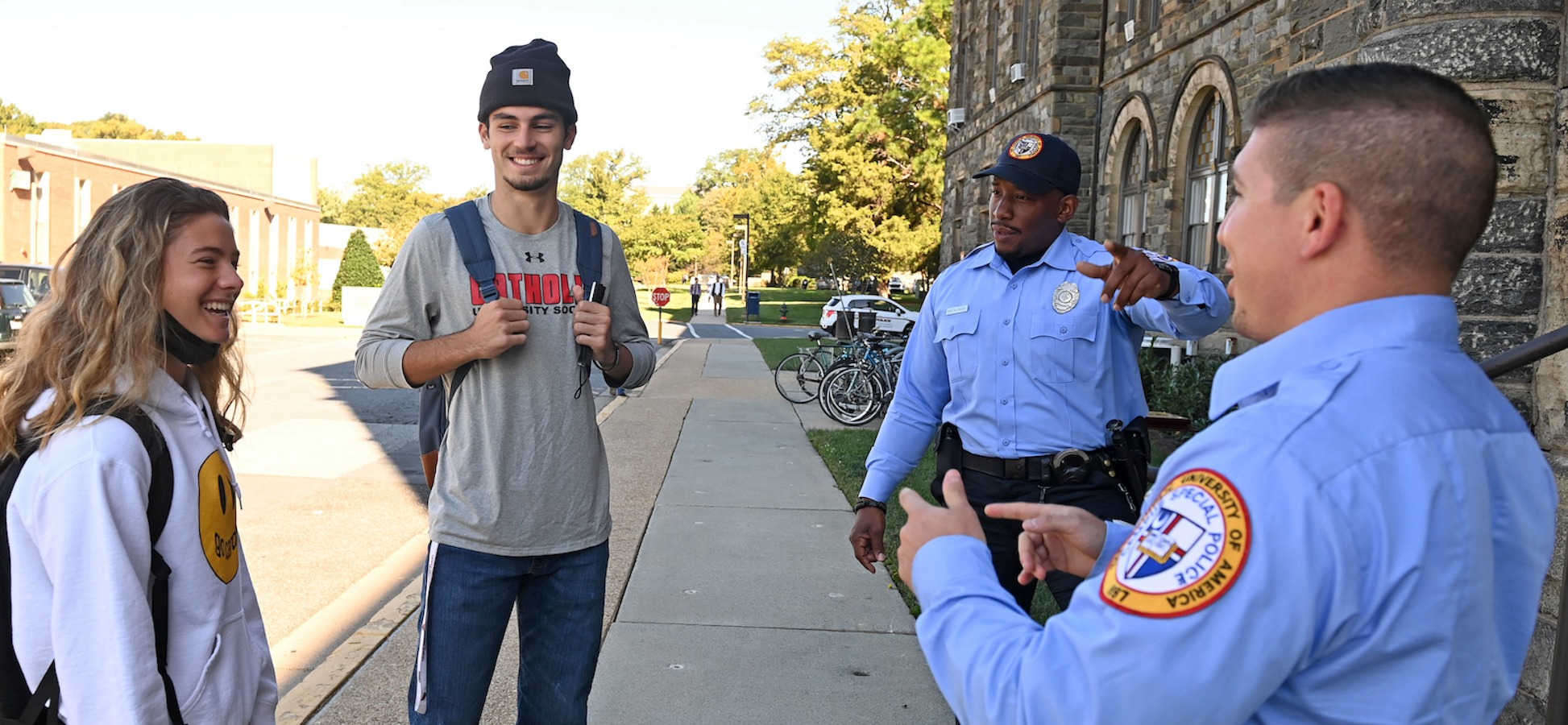 students chatting with DPS officers