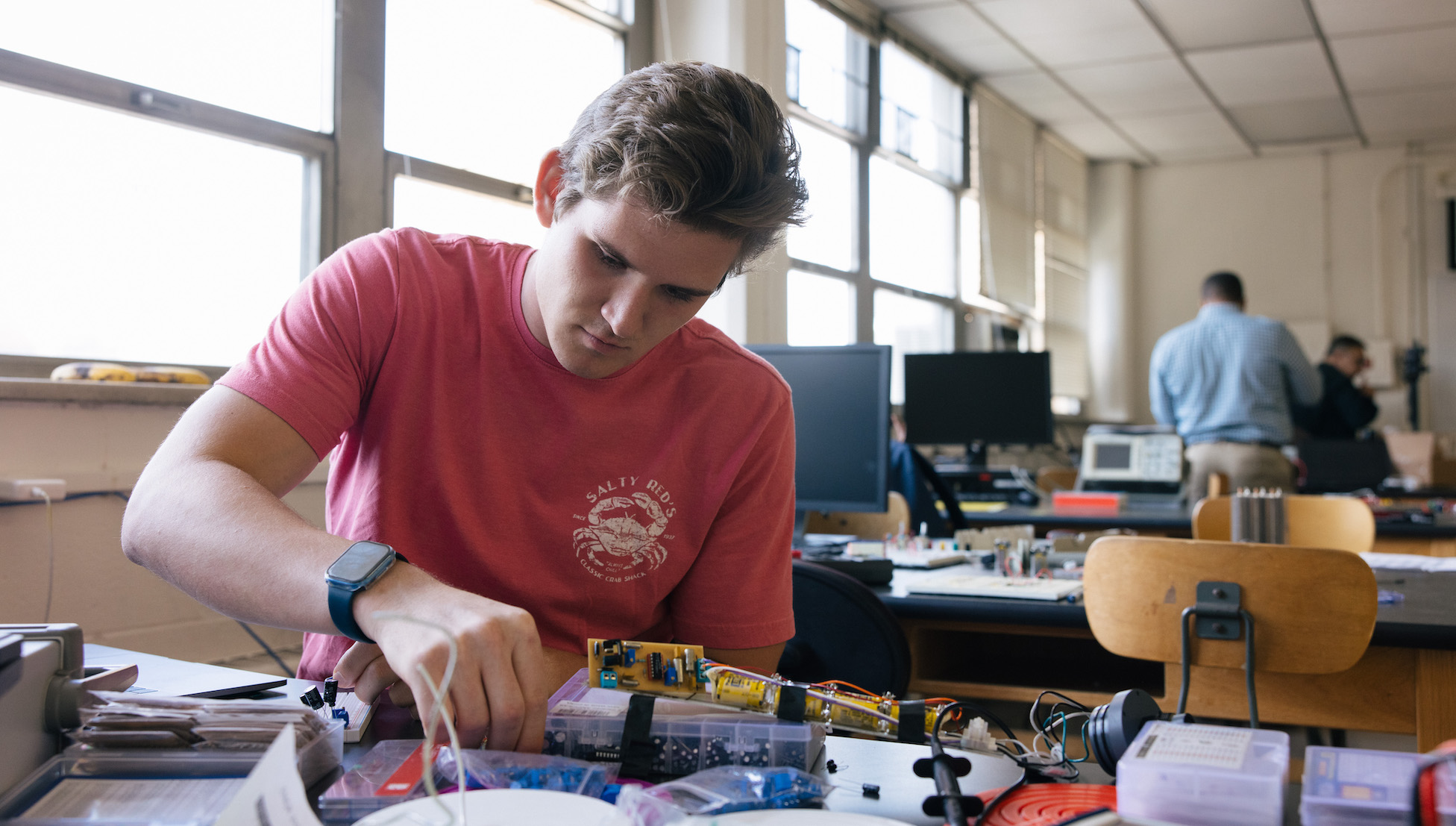 student working intently on an engineering project