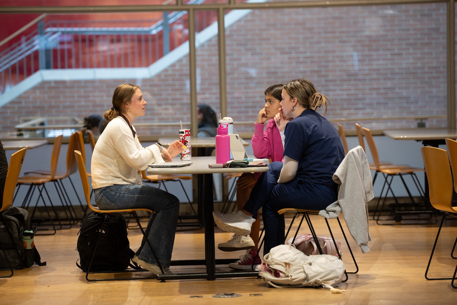 girls chatting over a meal in the catholic university food court