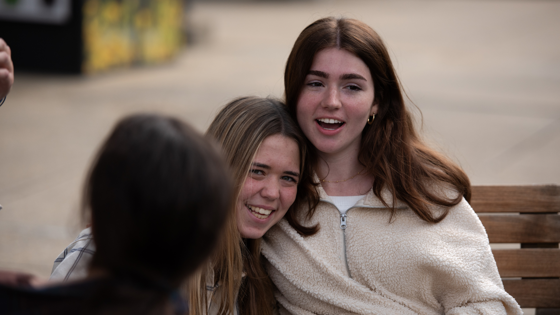 girls hugging and smiling