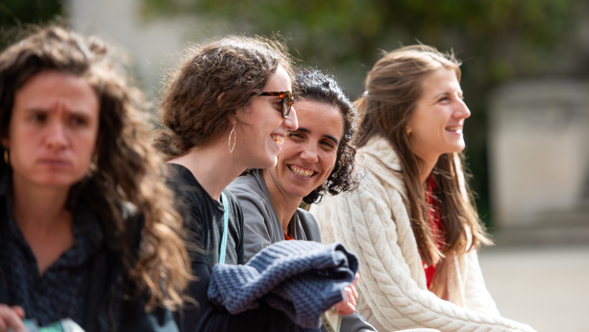 students chatting in an outdoor space on campus