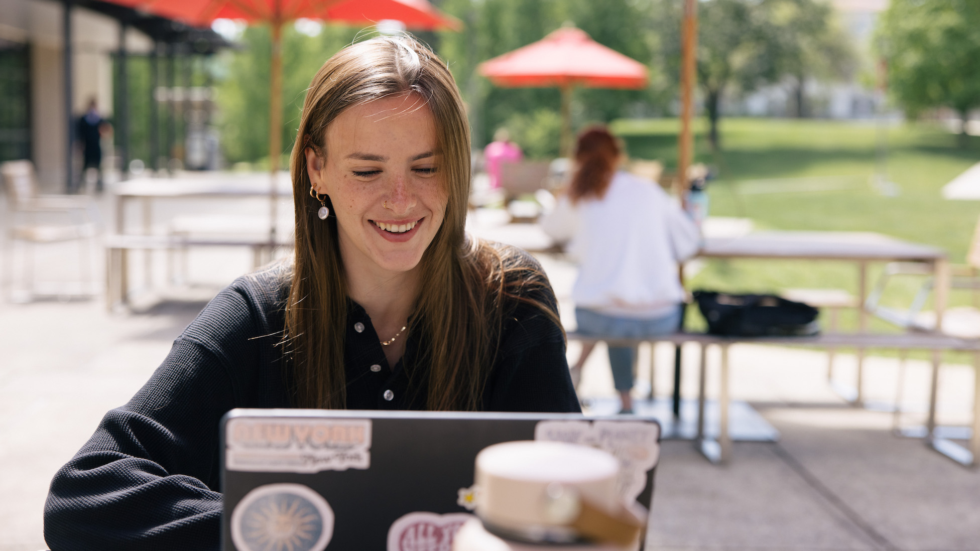 happy student working on laptop