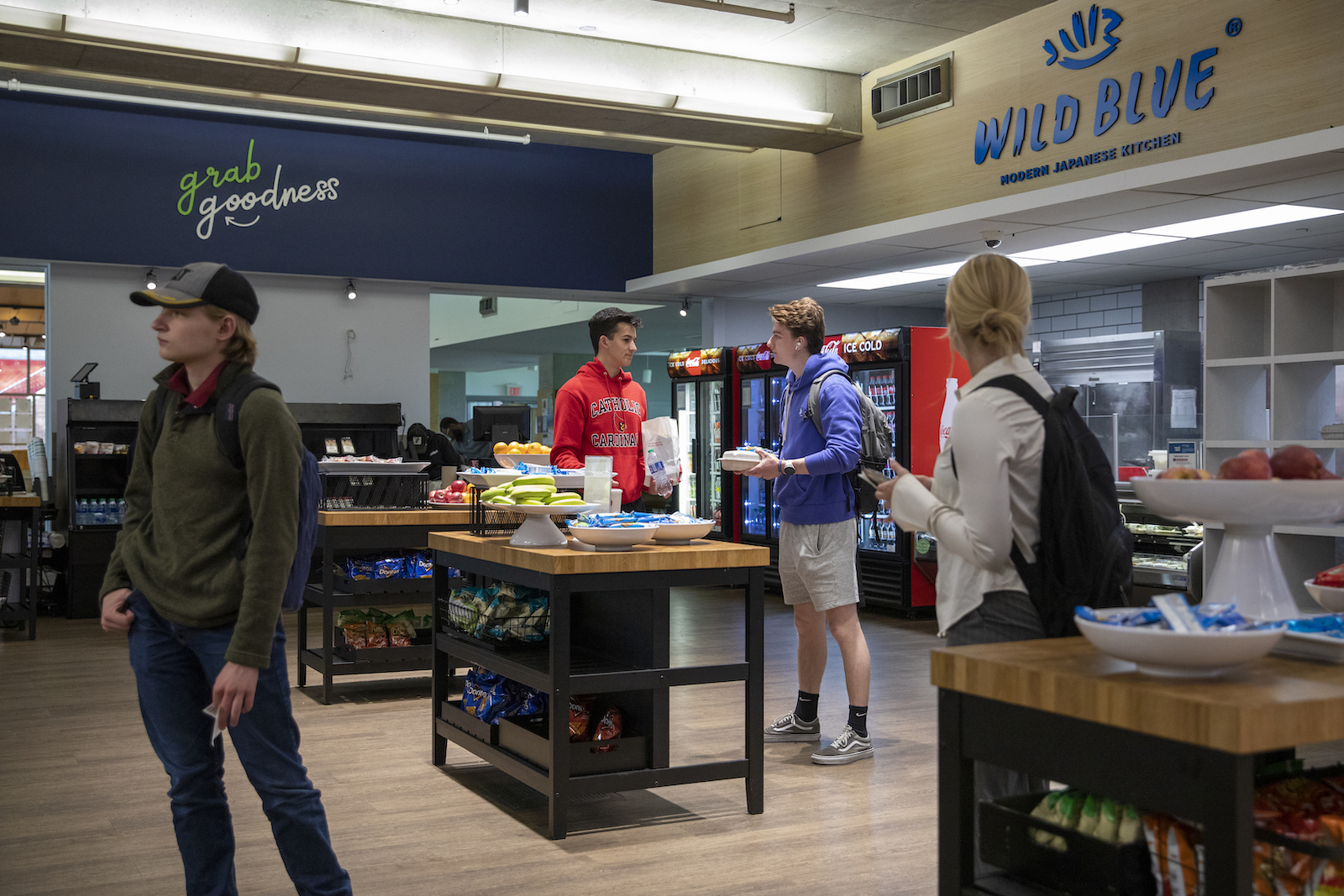 students picking out food in the CUA food court