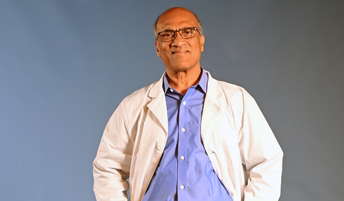 Dr. Rao in a lab coat