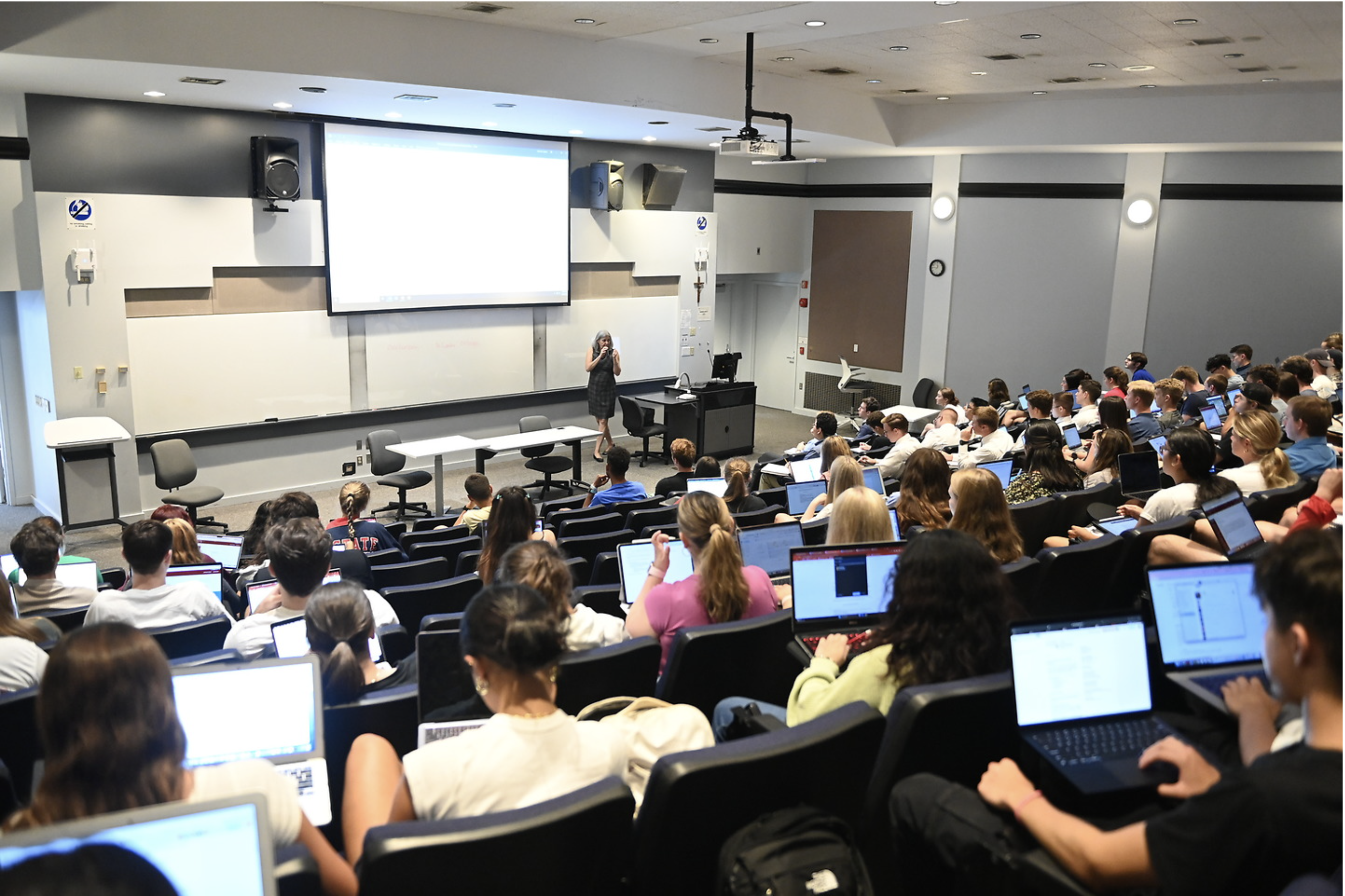 a lecture hall with professor instructing