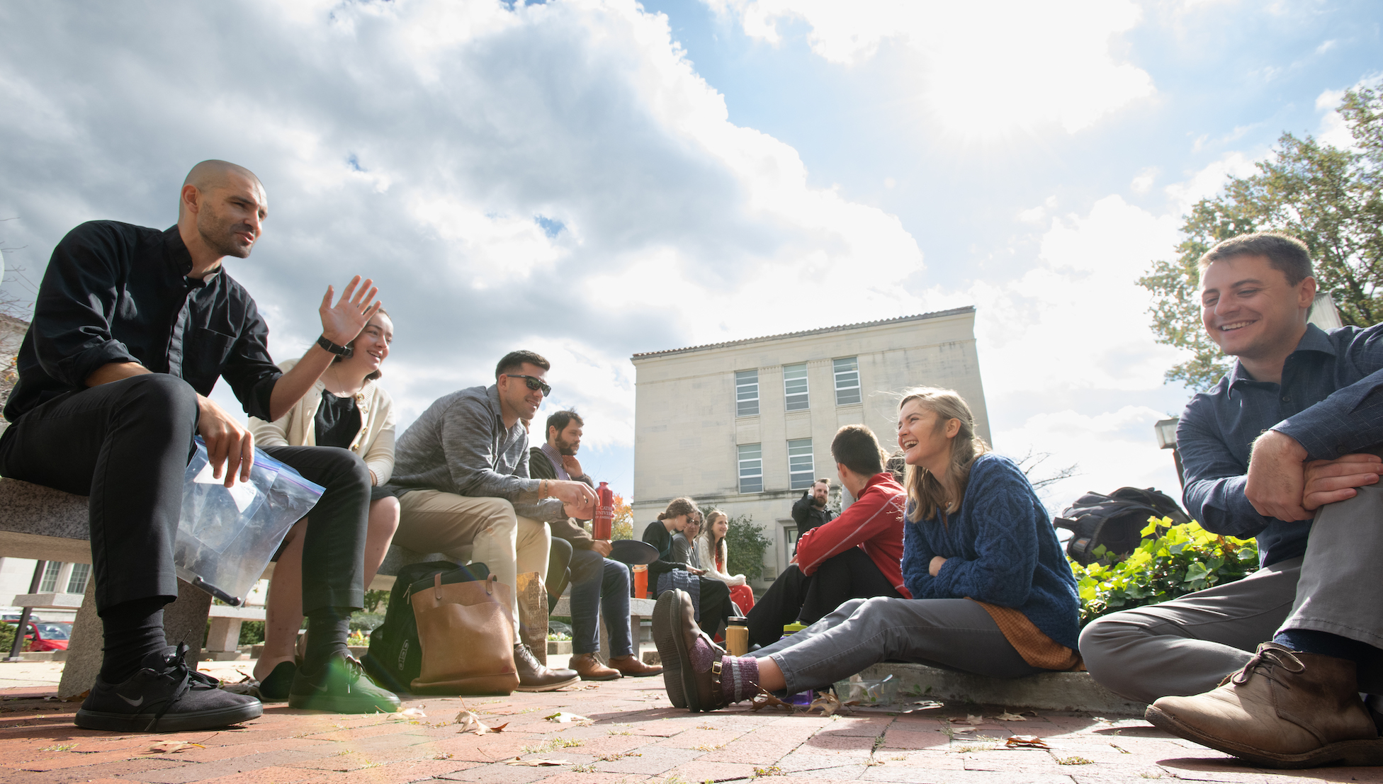 graduate students hanging out outside together