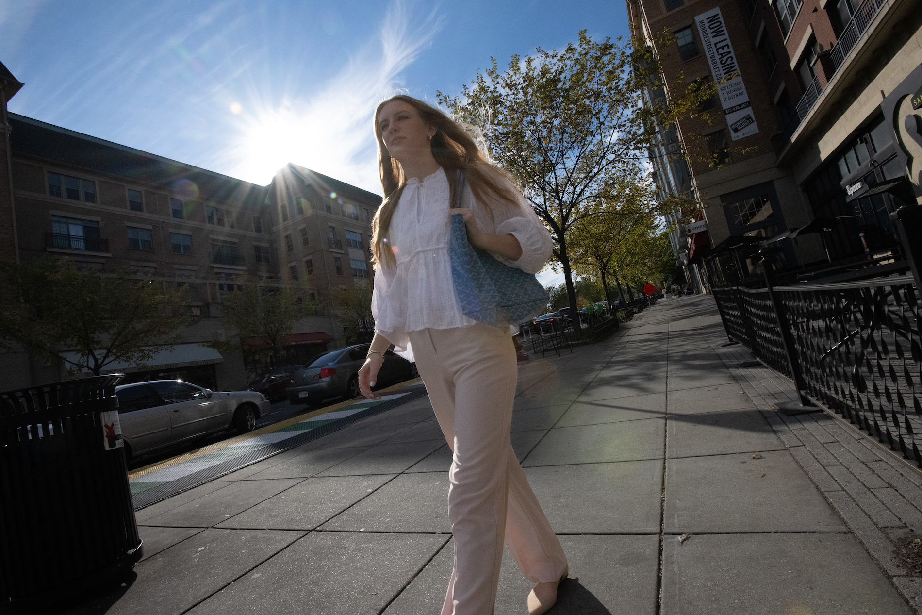 student dressed professionally walking down the street in DC