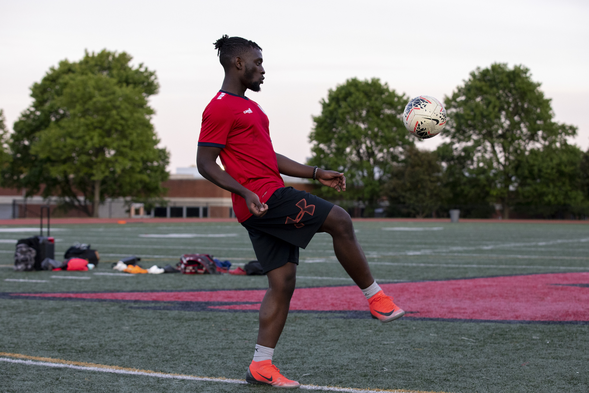 student practicing for the men's soccer team