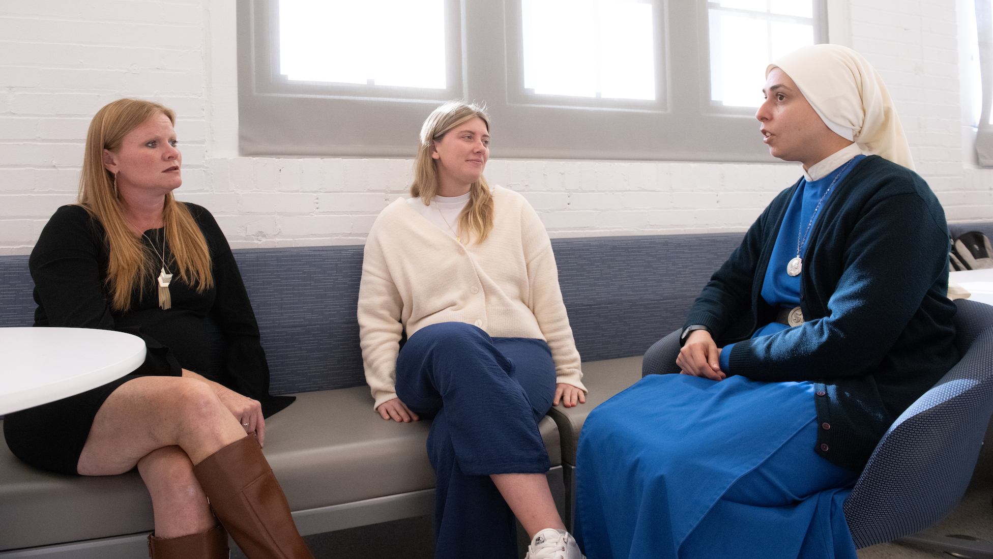 religious sister talking with campus community members