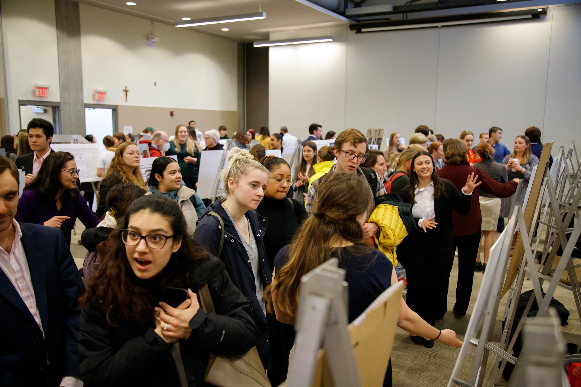 crowd gathered in the pryzbyla center to listen to all the poster presentations on university research day