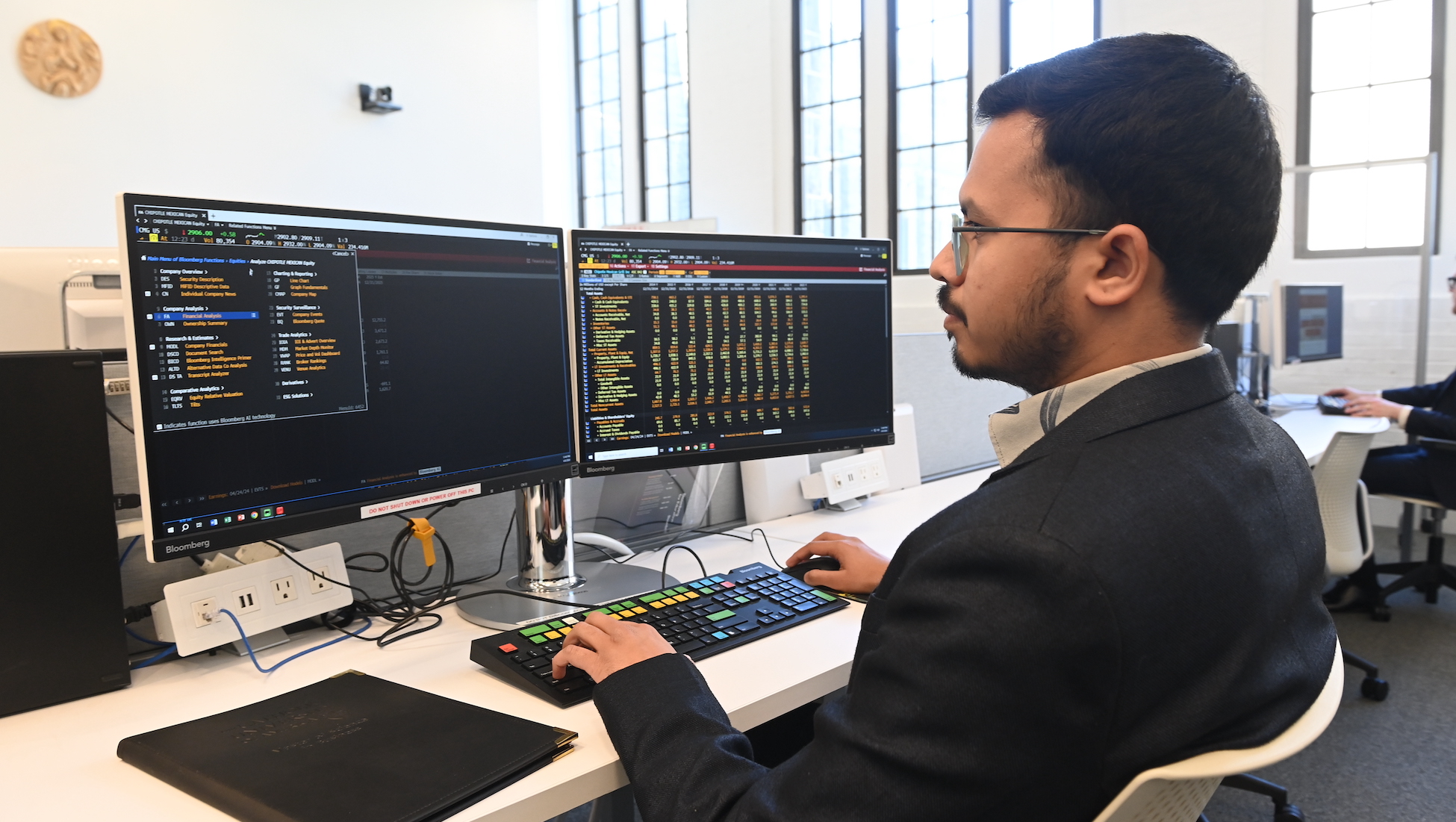 student looking at analytics on a computer screen