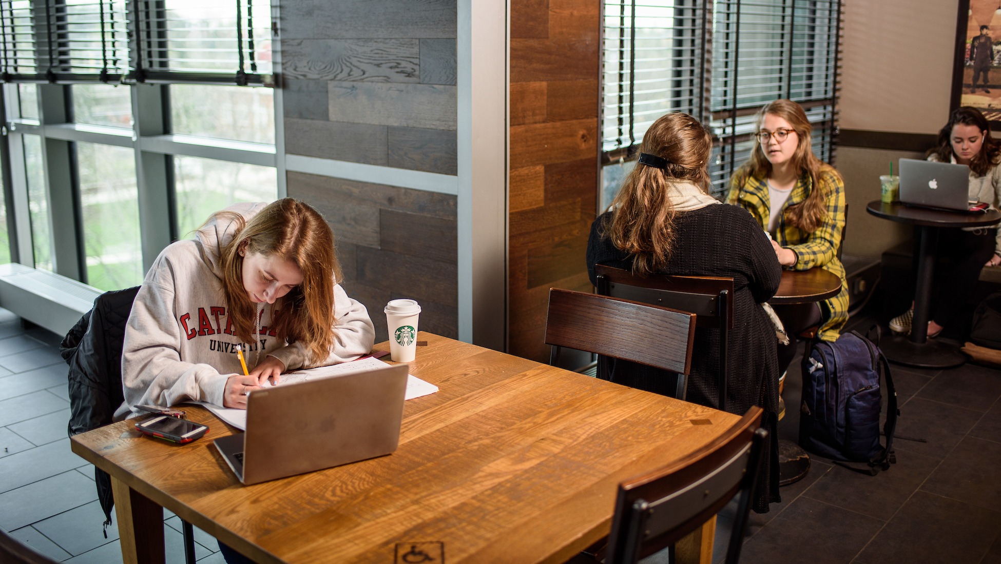 student studying in starbucks