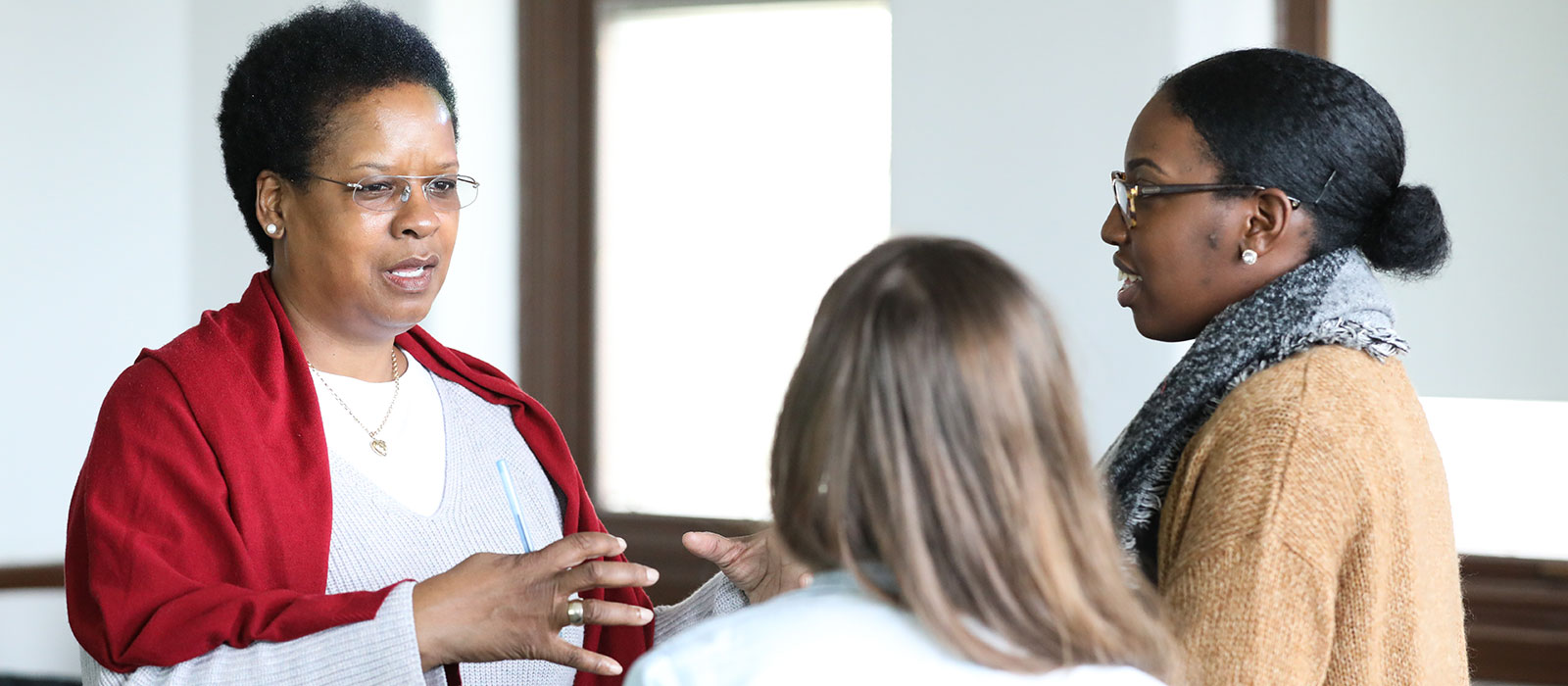 professor talking with students