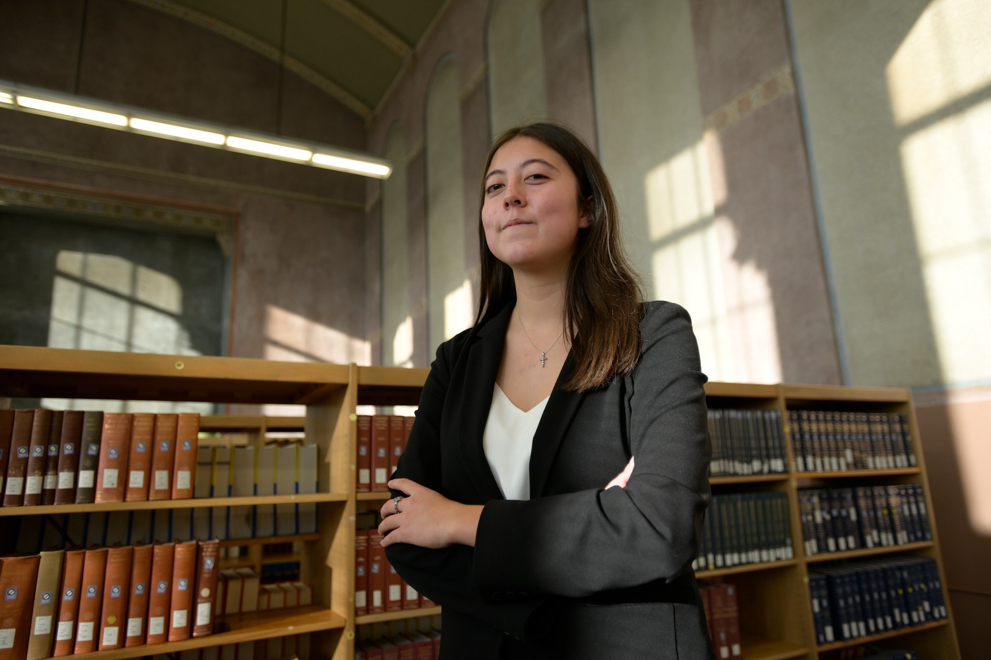 student dressed professionally in the catholic university library