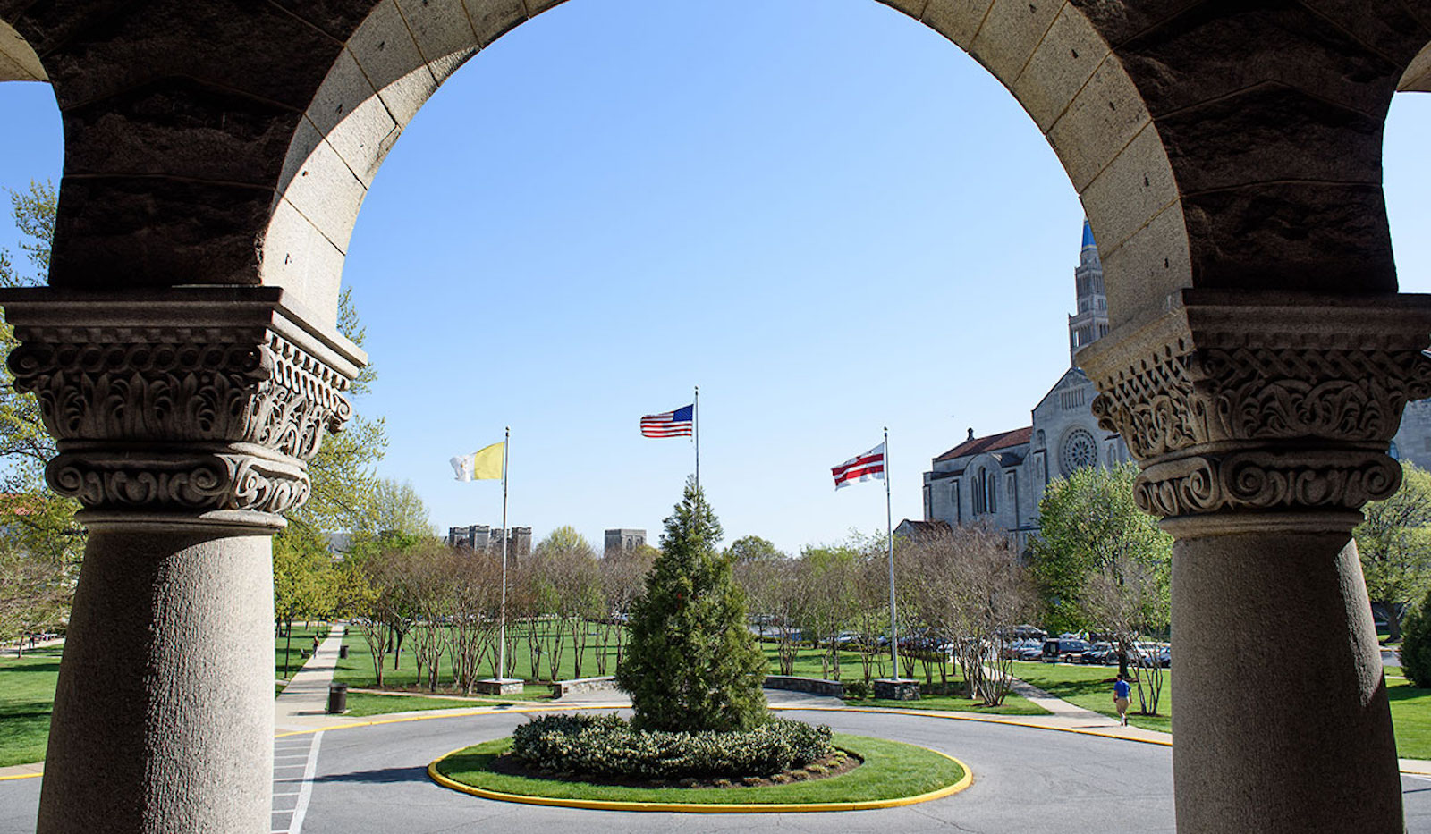 view of campus from archway in mcmahon hall