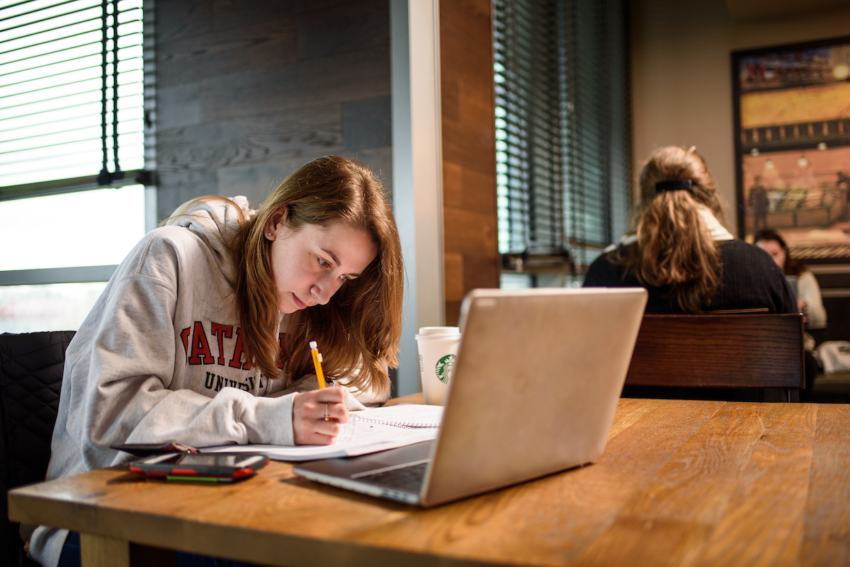 A student studying at Murphy's on campus.