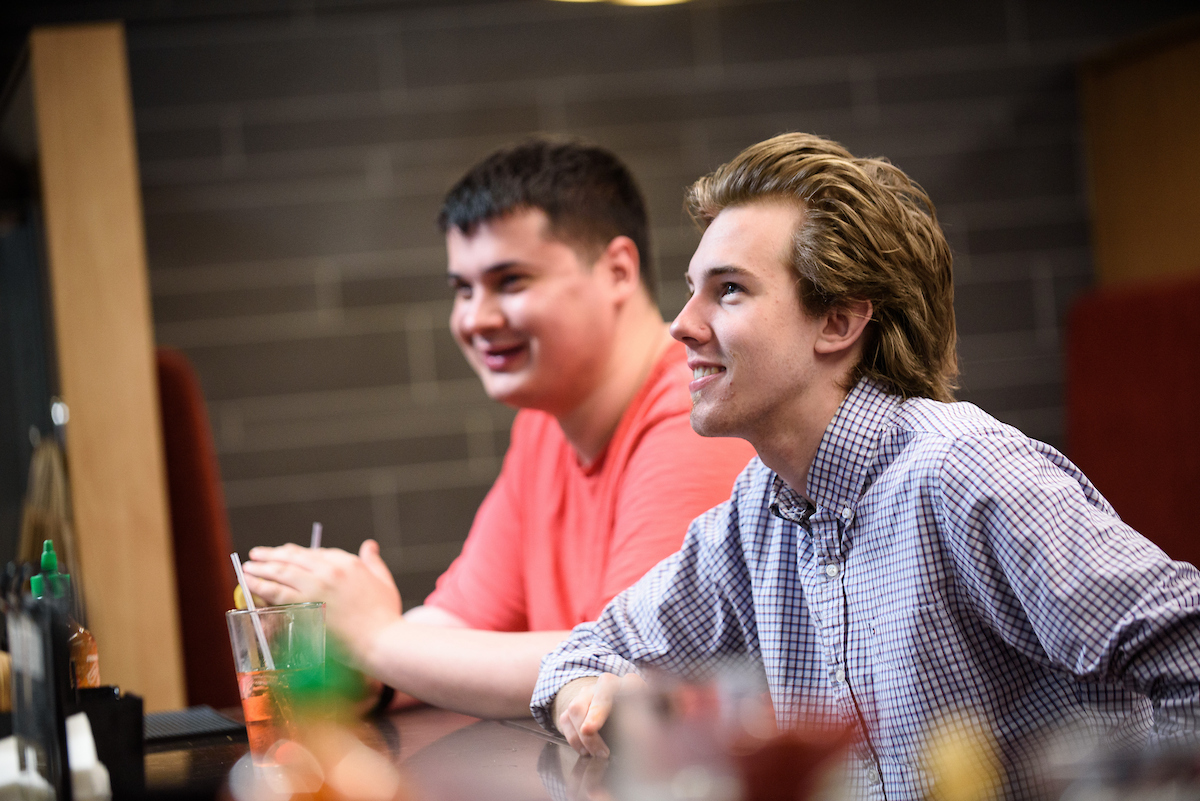 Two students are dining together at Murphy's.