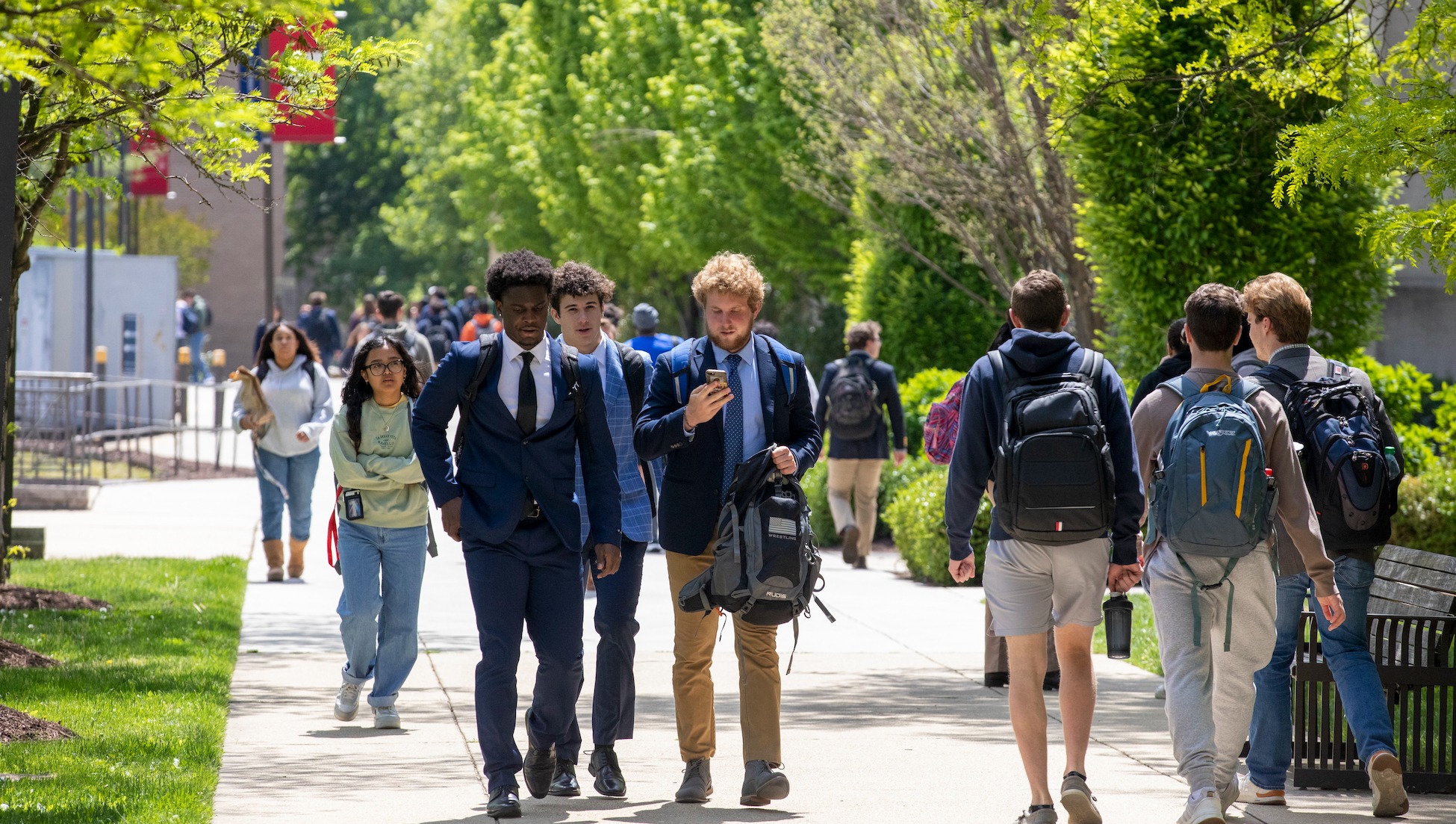 group of male students walking to class together