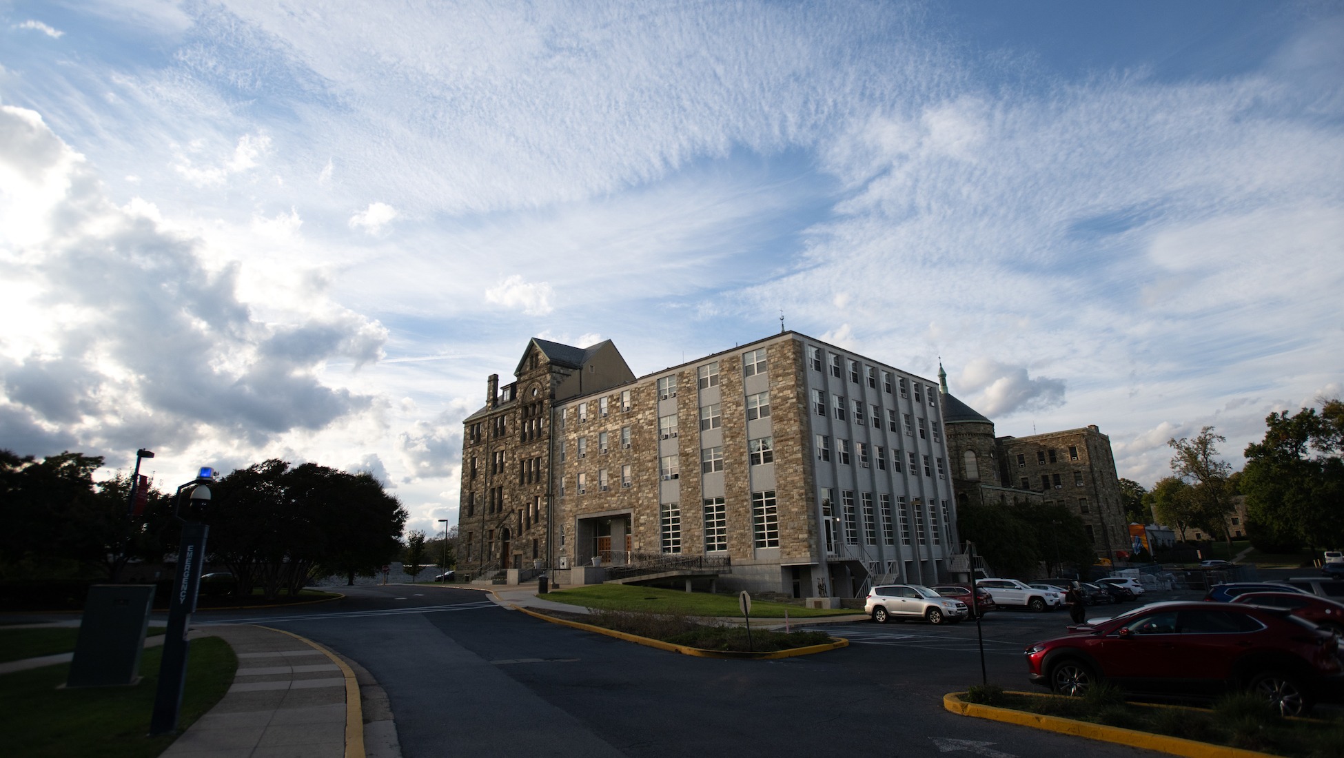 exterior of caldwell hall and nearby parking lot