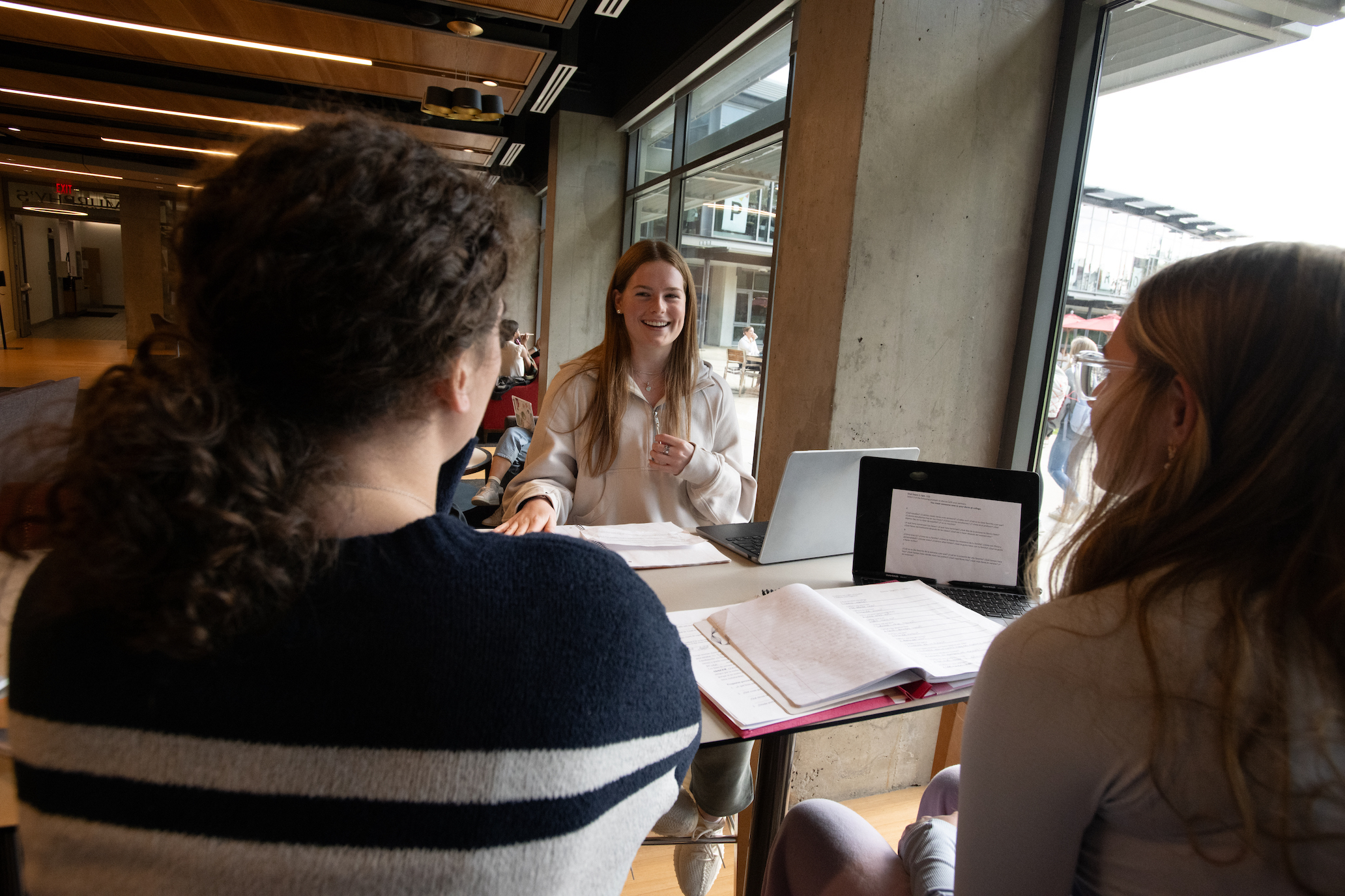 students at a table talking