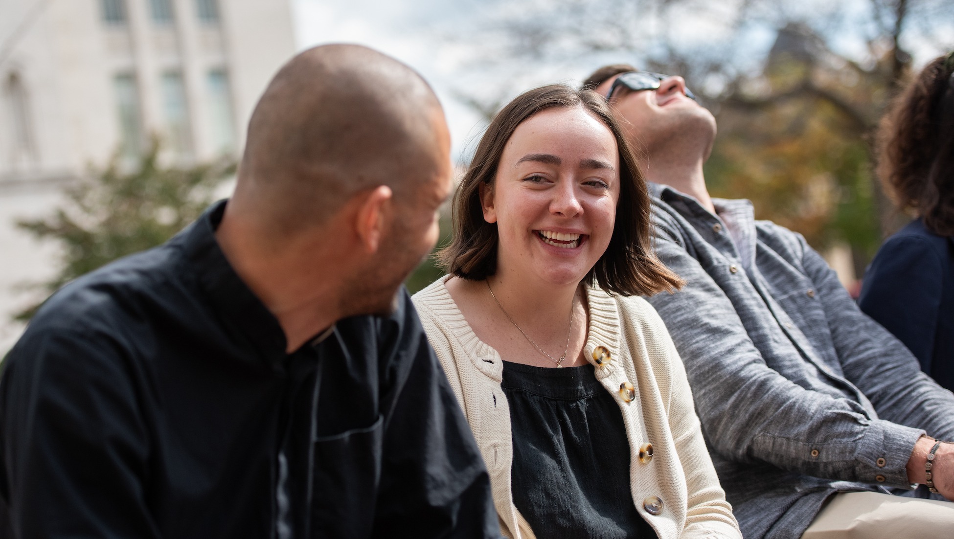 graduate students chatting outdoors