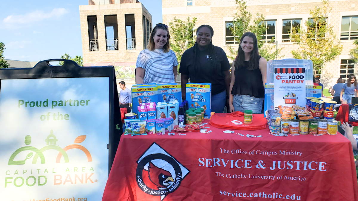 Students working a food bank information table