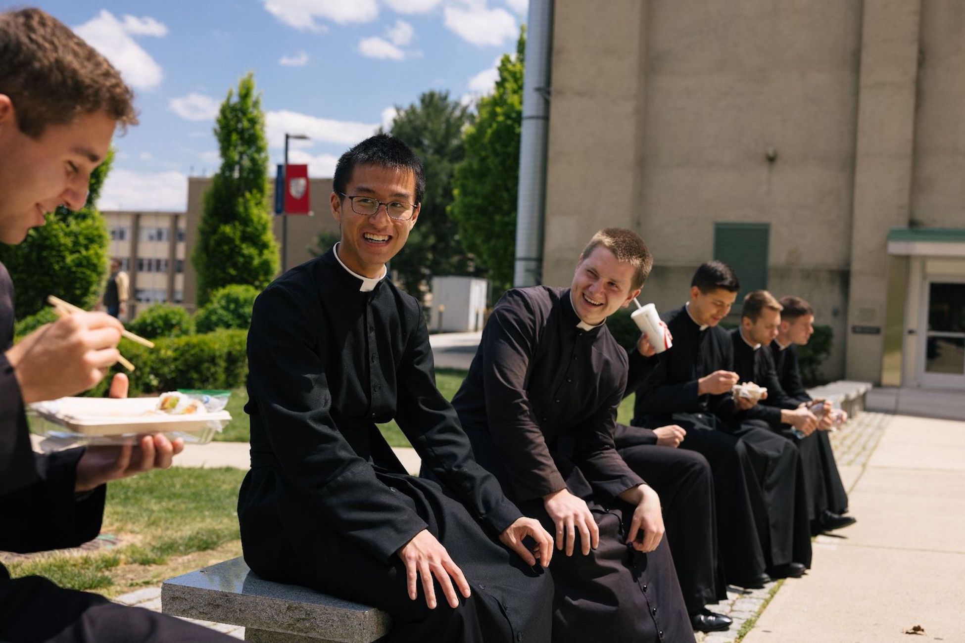 seminarians chatting and laughing on campus together